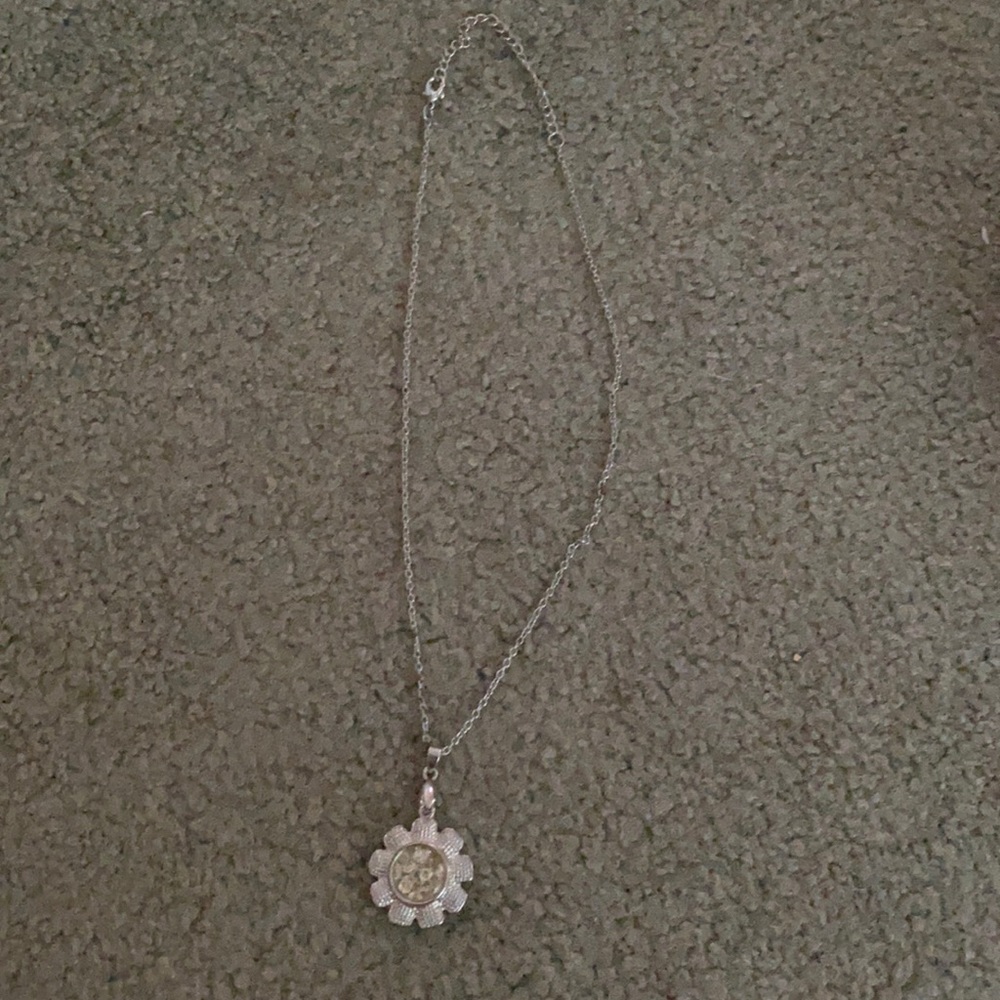 Flower necklace with little plastic jewels in it